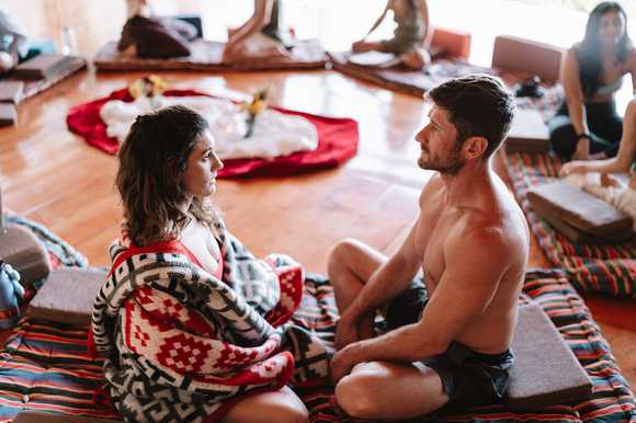 Two participants sharing an eye-gazing connection exercise